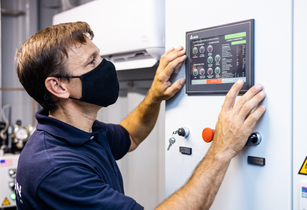 Man checking stats on a machine